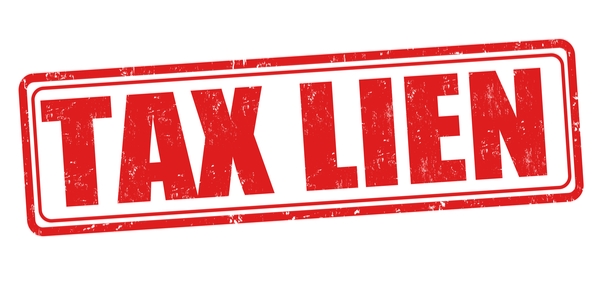 A red stamp labeled TAX LIEN