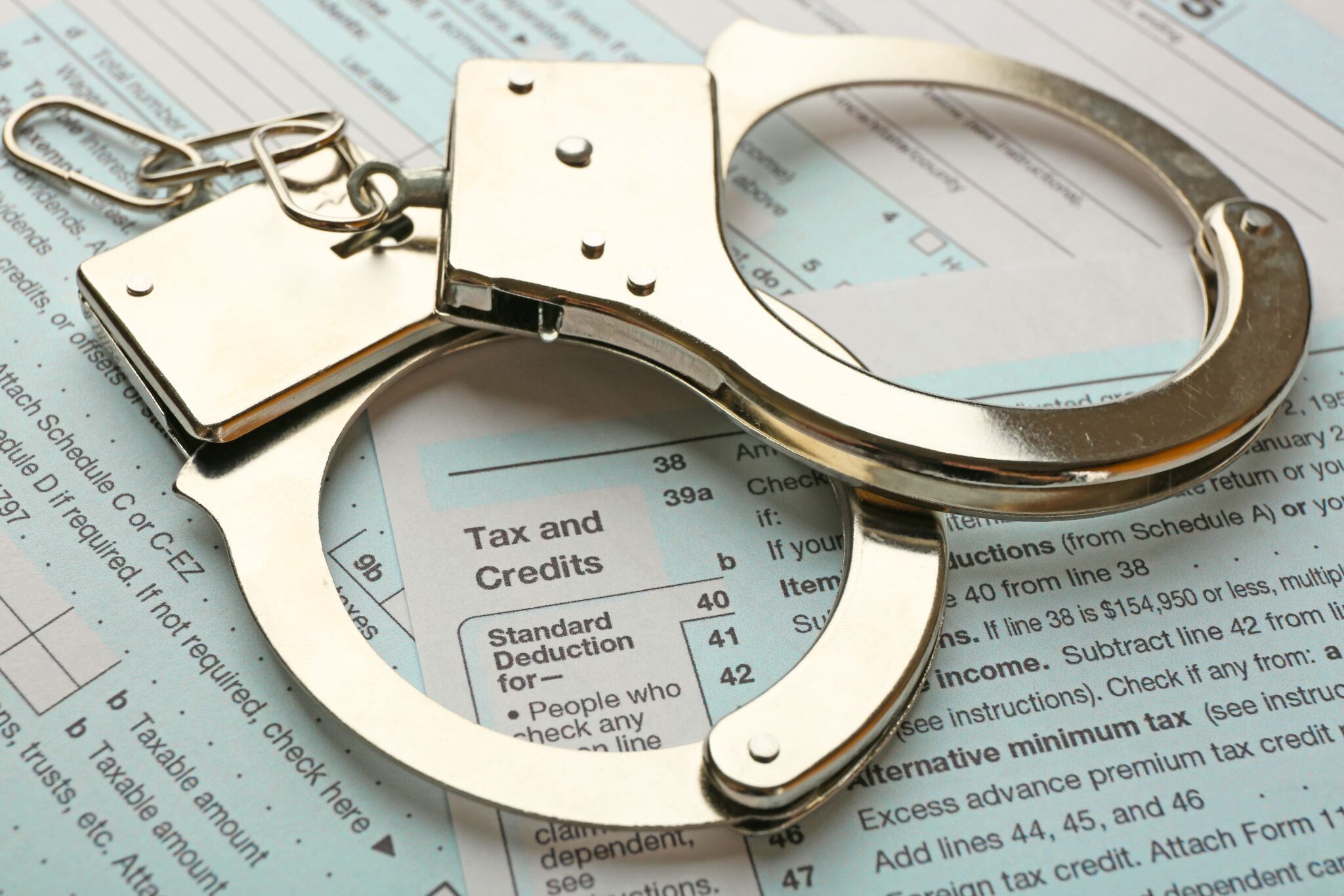 Handcuffs on Tax Returns Criminal Tax Defense Lawyer Troy Michigan