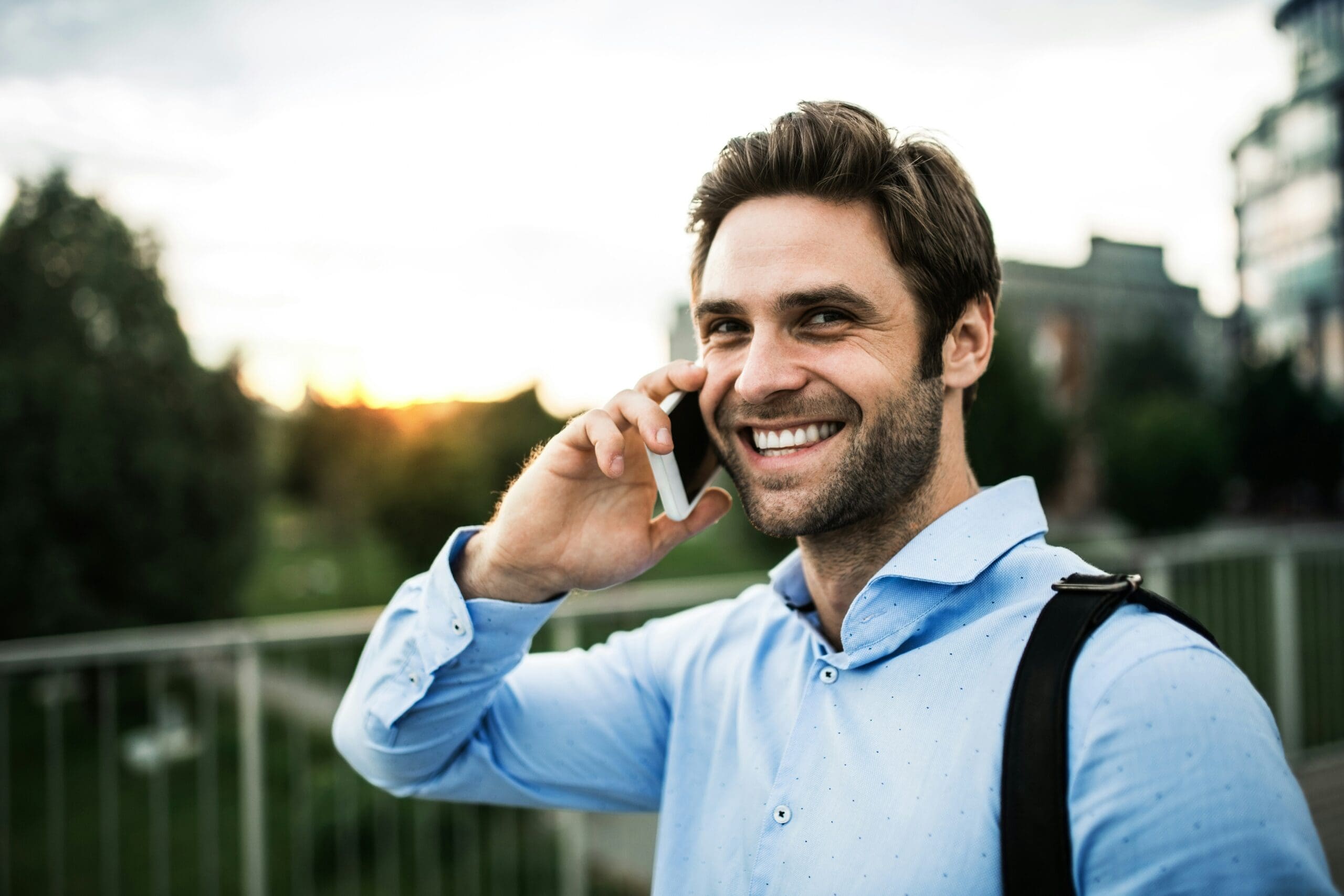 Happy Man Calling Livonia Tax Attorney